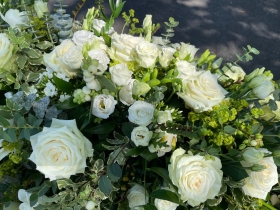 White funeral spray with roses & Lisianthus