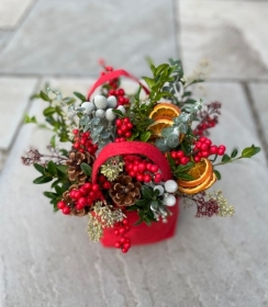 Scarlet winter arrangement in a felt bag